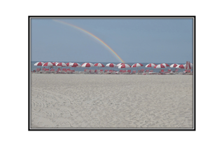 beach umbrellas with rainbow