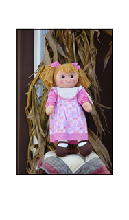 Corn Husk Doll on Quilt